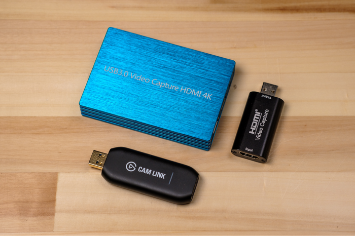 Clockwise from bottom: Elgato Cam Link 4K, no-name USB 3.0 capture card, and Y&H HDMI Video Capture Card. Clockwise from bottom: Elgato Cam Link 4K, no-name USB 3.0 capture card, and Y&H HDMI Video Capture Card.