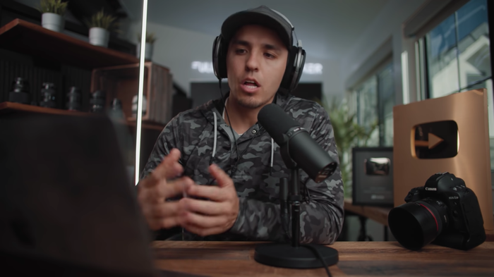 Parker Wallback’s scene is full of context, notably the camera and the YouTube award in the front right of his shot establish authority Parker Wallback’s scene is full of context, notably the camera and the YouTube award in the front right of his shot establish authority