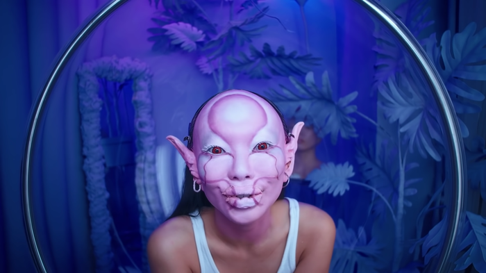 Princess Gollum’s purple makeup contrasts with the blue backdrop Princess Gollum’s purple makeup contrasts with the blue backdrop